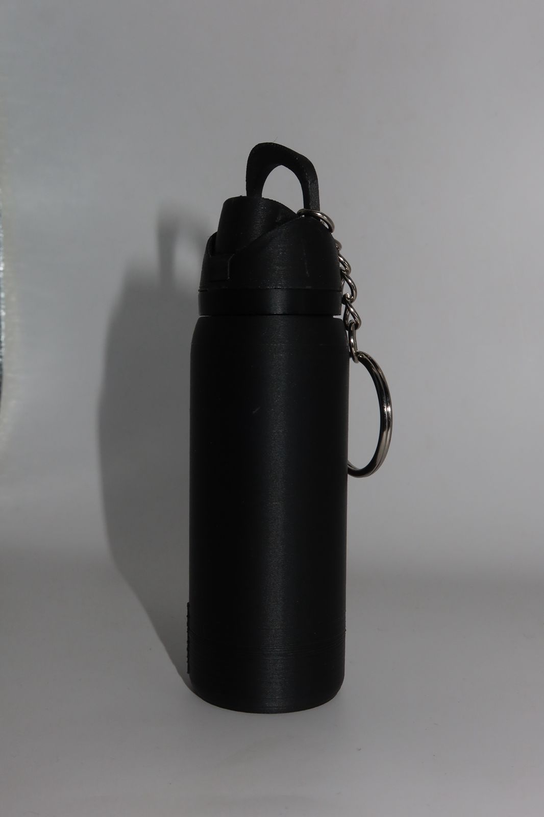 Funda para bálsamo labial en forma de termo